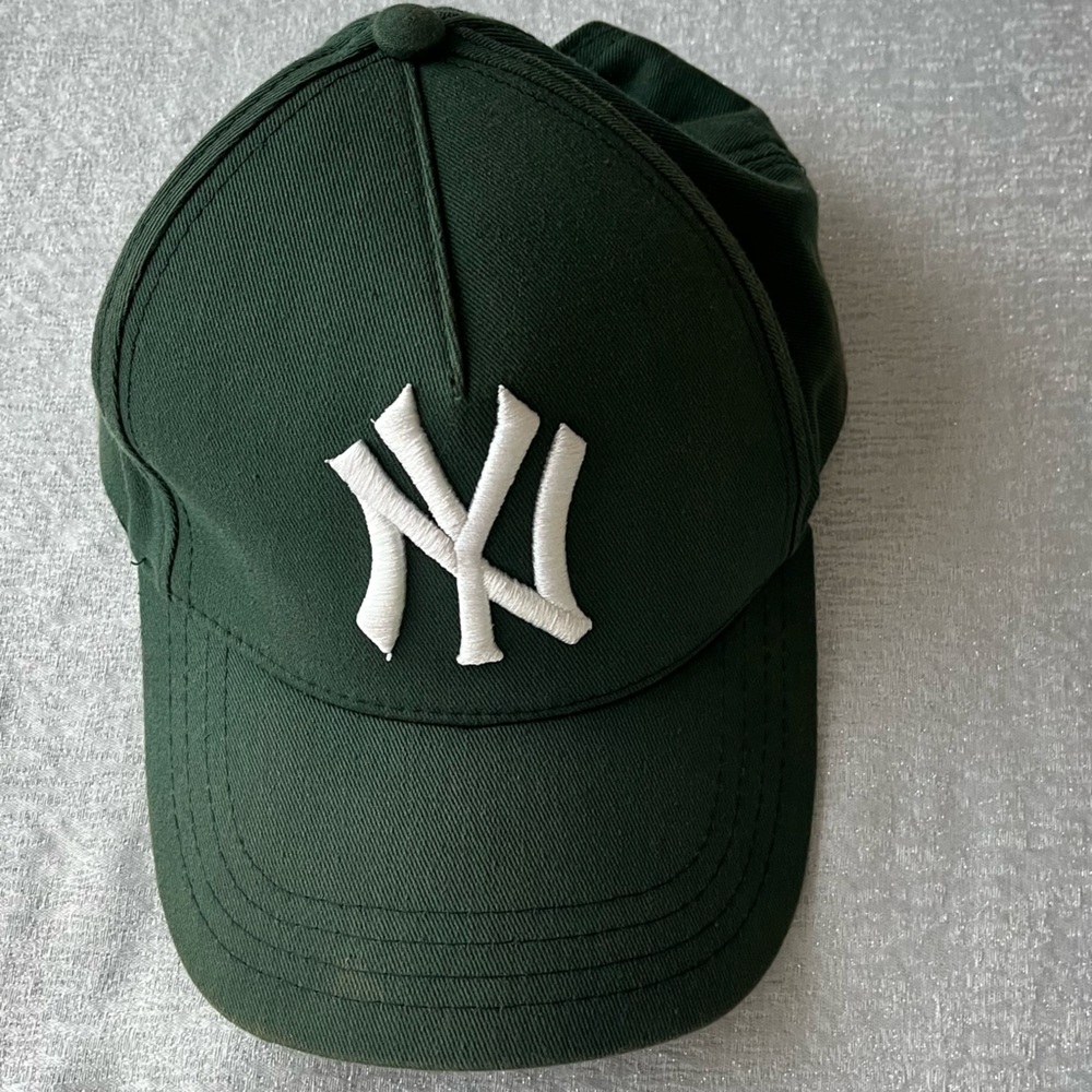 Green and white Yankees baseball cap